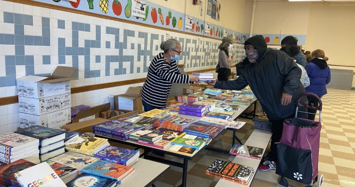 Parents, kids enjoy thousands of free books at giveaway event at Mott Haven school