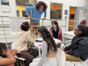 students prepare to present a project